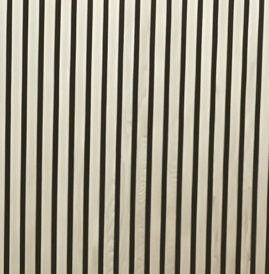 Ash slat wall panel full view with pale grain veneer and vertical slat profile installed in home