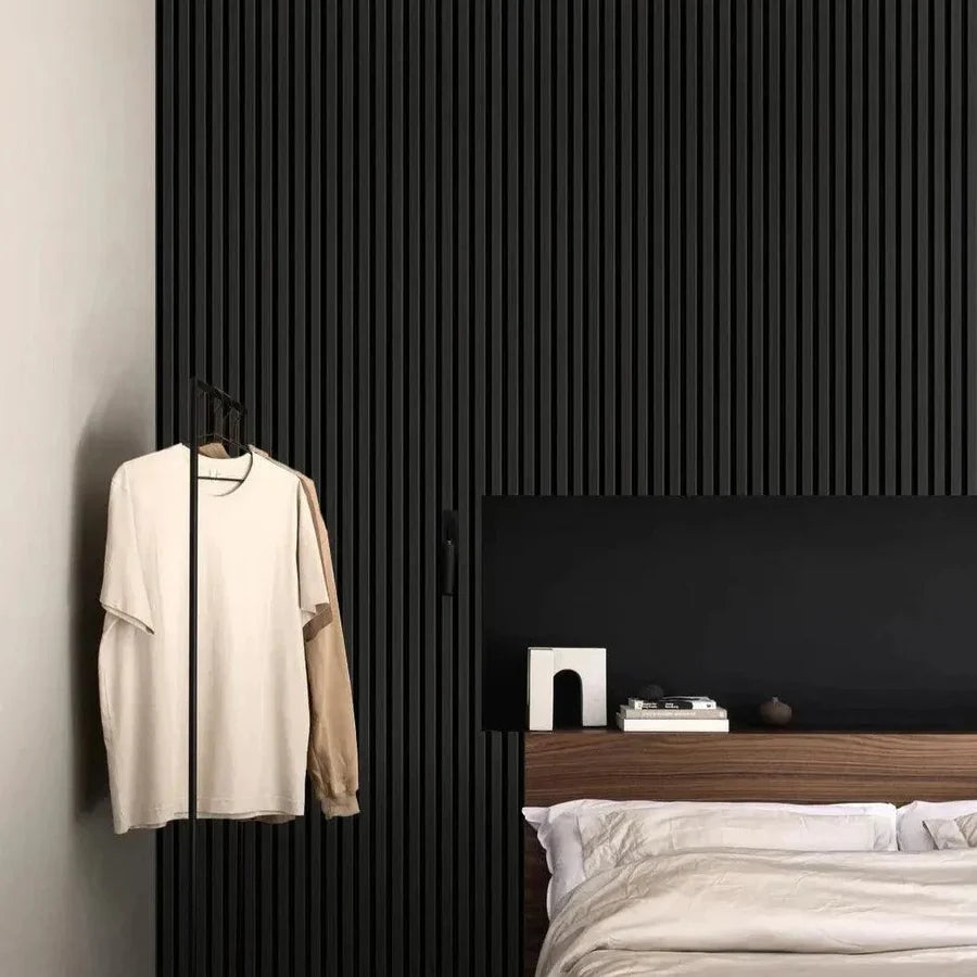 Black Oak wood slat acoustic panels installed in bedroom creating dark statement wall