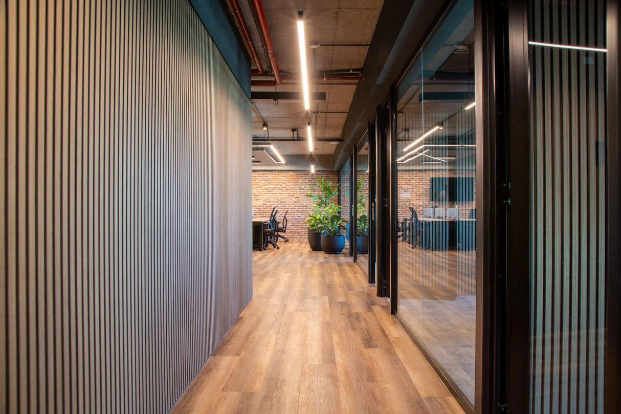 Natural Oak wood slat acoustic panels showing seamless panel join and clean installation